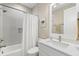 Bright bathroom featuring subway tile, modern fixtures, and a shower-tub combo with shower curtain at 1511 47Th N Ave, St Petersburg, FL 33703