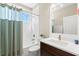 Bright bathroom features a shower-tub combination, white subway tile, and a modern vanity at 1511 47Th N Ave, St Petersburg, FL 33703