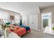 Comfortable bedroom has large windows, a sewing machine, and bathroom access at 1511 47Th N Ave, St Petersburg, FL 33703