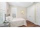 Inviting bedroom with wood floors, plantation shutters, and comfortable decor; a restful retreat at 1511 47Th N Ave, St Petersburg, FL 33703