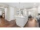 Contemporary kitchen with a large island, stainless appliances, and seamless flow to dining and other living spaces at 1511 47Th N Ave, St Petersburg, FL 33703