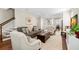 Comfortable living room with hardwood floors connecting to a modern kitchen and staircase at 1511 47Th N Ave, St Petersburg, FL 33703