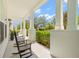 Spacious porch with comfortable rocking chairs, offering a relaxing outdoor living space at 1511 47Th N Ave, St Petersburg, FL 33703