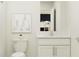 Bathroom featuring modern vanity with quartz countertop and a view to bedroom at 15276 Rainbow Quartz St, Wimauma, FL 33598