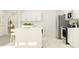 Bright, modern kitchen with white cabinetry, sleek appliances, and a functional island, perfect for cooking at 15276 Rainbow Quartz St, Wimauma, FL 33598