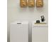 Functional laundry room with modern appliances and storage, designed for efficient home care and organization at 15276 Rainbow Quartz St, Wimauma, FL 33598