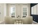 Inviting living room with modern chairs, soft lighting, and stylish decor for a cozy gathering space at 15276 Rainbow Quartz St, Wimauma, FL 33598