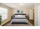 Cozy bedroom featuring a comfortable bed, side tables, and neutral decor at 1602 E New Orleans Ave, Tampa, FL 33610