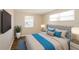 Bright bedroom features stylish decor, a large bed, and natural light from the two windows at 1602 E New Orleans Ave, Tampa, FL 33610