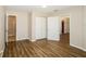 Spacious bedroom with wood flooring and natural light at 1602 E New Orleans Ave, Tampa, FL 33610