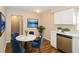 Cozy dining area with marble table, blue velvet chairs, and modern décor at 1602 E New Orleans Ave, Tampa, FL 33610