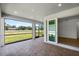 Screened lanai with brick flooring, with sliding door access at 17920 Nadine Pl, Nokomis, FL 34275