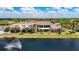 Aerial view of clubhouse overlooking fountain and lake at 2011 Halidom Way # 0, Sun City Center, FL 33573