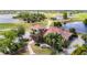 Aerial view of clubhouse near golf course, lakes, and lush landscaping at 2011 Halidom Way # 0, Sun City Center, FL 33573