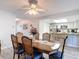 Open-concept dining area with seating for six, seamlessly connected to the kitchen at 2011 Halidom Way # 0, Sun City Center, FL 33573