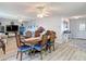 Inviting dining area featuring a wooden table, seating for six, and wood flooring at 2011 Halidom Way # 0, Sun City Center, FL 33573