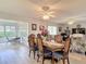 Inviting dining area featuring a wooden table, seating for six, and wood flooring at 2011 Halidom Way # 0, Sun City Center, FL 33573