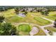 Aerial view of community golf course featuring sand traps and pristine greens at 2011 Halidom Way # 0, Sun City Center, FL 33573
