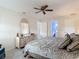 Inviting bedroom featuring a ceiling fan, neutral tones, and comfortable furnishings for a peaceful ambiance at 2011 Halidom Way # 0, Sun City Center, FL 33573