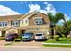 Charming two-story townhome with a well-manicured lawn, a two-car garage, and stylish exteriors at 2117 Lake Waters Pl, Lutz, FL 33558