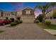 Charming townhome with well-manicured landscaping, brick driveway, and an attached garage at 2117 Lake Waters Pl, Lutz, FL 33558