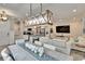 Spacious open-concept living area features stylish furnishings, abundant natural light, and modern accents at 2117 Lake Waters Pl, Lutz, FL 33558