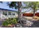 Backyard featuring mature trees that add shade to this outdoor living space at 2131 Cedar Dr, Dunedin, FL 34698