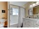 Bathroom with shower tub combo and white vanity at 2131 Cedar Dr, Dunedin, FL 34698