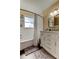 Bathroom showcasing a shower/tub and sleek white vanity with ample storage at 2131 Cedar Dr, Dunedin, FL 34698