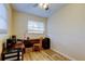 Bright bedroom features wood-look floors and window, perfect for a home office setup at 2131 Cedar Dr, Dunedin, FL 34698