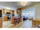 Updated kitchen with stainless steel appliances, wooden cabinets, granite countertops, and breakfast bar seating at 2131 Cedar Dr, Dunedin, FL 34698