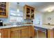 Close up of kitchen sink, stainless steel appliances, and granite countertops at 2131 Cedar Dr, Dunedin, FL 34698