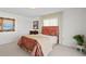 Bedroom showcases an eye-catching headboard, complemented by soft lighting, natural light, and serene decor at 2171 E Vina Del Mar Blvd, St Pete Beach, FL 33706