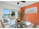 Cozy dining area with water views, stylish chairs, and a round glass table perfect for entertaining at 2171 E Vina Del Mar Blvd, St Pete Beach, FL 33706