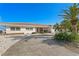 Exterior home with beautiful landscaping and a large driveway at 2171 E Vina Del Mar Blvd, St Pete Beach, FL 33706