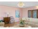 Elegant living room with a crystal chandelier, classic furnishings, and light-colored walls at 2171 E Vina Del Mar Blvd, St Pete Beach, FL 33706