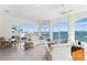 Bright living room with tile floors, ceiling fans and beautiful water view at 2171 E Vina Del Mar Blvd, St Pete Beach, FL 33706