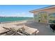 Patio with chaise lounges overlooking waterfront views at 2171 E Vina Del Mar Blvd, St Pete Beach, FL 33706