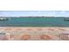 Beautiful waterfront view from the property, featuring a boat dock and a distant bridge at 2171 E Vina Del Mar Blvd, St Pete Beach, FL 33706