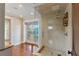 Luxurious bathroom with a glass-enclosed shower and doors leading to a balcony with water view at 2320 Coffee Pot Ne Blvd, St Petersburg, FL 33704