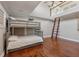 Bedroom with hardwood floors, a bunk bed, and a ladder at 2320 Coffee Pot Ne Blvd, St Petersburg, FL 33704