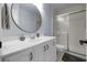Updated bathroom featuring vanity with a stylish mirror and glass-enclosed shower at 25 Woods Landing Trl, Oldsmar, FL 34677