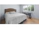 Comfortable bedroom with plantation shutters, neutral colors, and natural light at 25 Woods Landing Trl, Oldsmar, FL 34677
