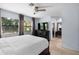 Spacious primary bedroom featuring a ceiling fan and large windows at 25 Woods Landing Trl, Oldsmar, FL 34677