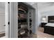 Functional closet featuring storage shelves and mirrored doors at 25 Woods Landing Trl, Oldsmar, FL 34677