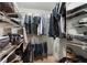 Organized walk-in closet with shelving and hanging space for efficient storage at 25 Woods Landing Trl, Oldsmar, FL 34677