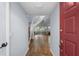 Bright entryway featuring hardwood floors, stairs, and an open view to the living area creating a welcoming atmosphere at 25 Woods Landing Trl, Oldsmar, FL 34677