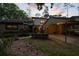 Charming townhouse with a covered carport and mature landscaping, creating a welcoming and private entrance at 25 Woods Landing Trl, Oldsmar, FL 34677
