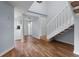 Bright foyer with wood flooring and staircase leading to the upper level at 25 Woods Landing Trl, Oldsmar, FL 34677