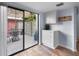 Bright kitchen with a sliding glass door leading to a private patio at 25 Woods Landing Trl, Oldsmar, FL 34677